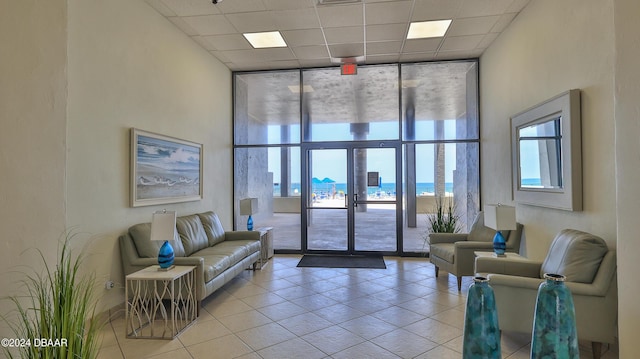 2987 S Atlantic Ave Unit 506, Daytona Beach, FL 32118 - common area featuring floor to ceiling windows, a water view, and a paneled ceiling
