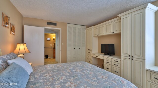 bedroom featuring a textured ceiling