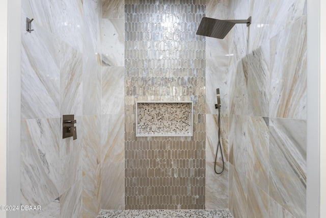 bathroom with a tile shower