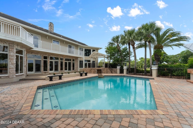 view of swimming pool with a patio