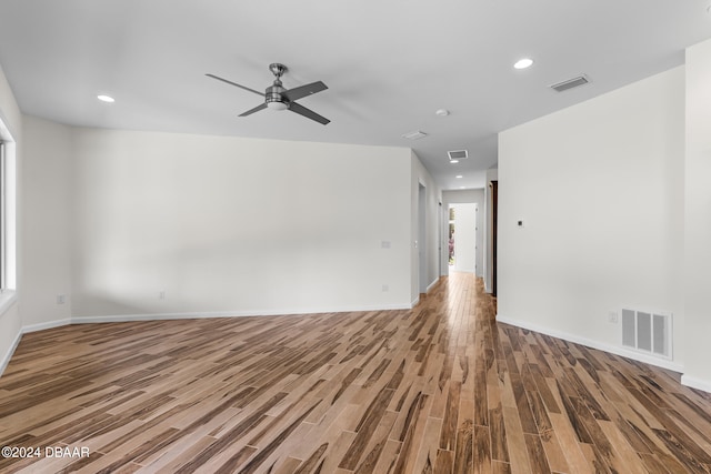 unfurnished room with hardwood / wood-style flooring and ceiling fan