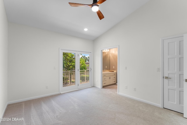 unfurnished bedroom featuring ceiling fan, access to exterior, ensuite bath, and light colored carpet