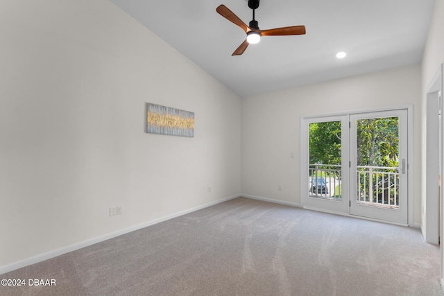 carpeted empty room featuring lofted ceiling and ceiling fan