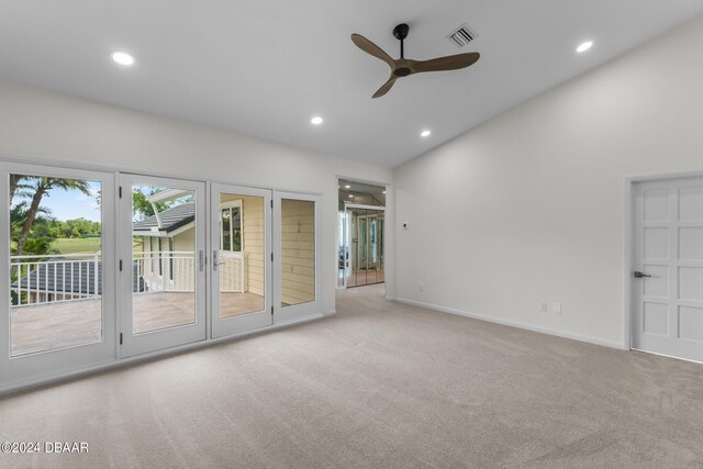 interior space featuring ceiling fan and light colored carpet