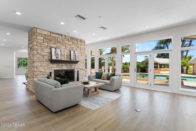 living room featuring a fireplace and light hardwood / wood-style floors