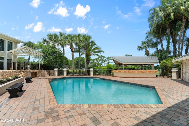 view of pool featuring a pergola and a patio area