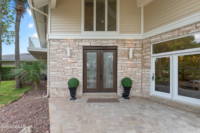 doorway to property featuring french doors