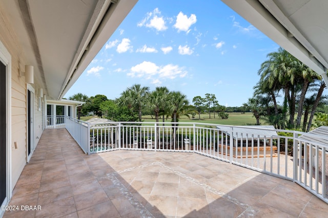 view of patio featuring a balcony