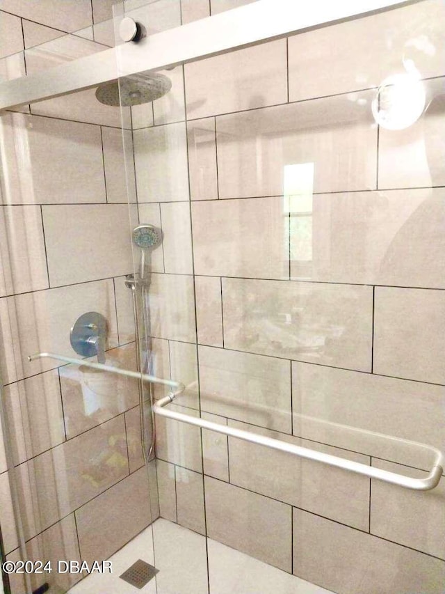 bathroom with tiled shower