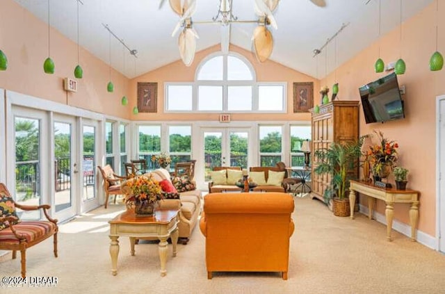 1401 S Palmetto Ave Unit 214, Daytona Beach, FL 32114 - living room with french doors, light carpet, and high vaulted ceiling