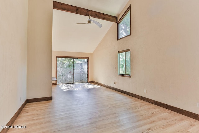 empty room with high vaulted ceiling, light wood-type flooring, ceiling fan, and beam ceiling