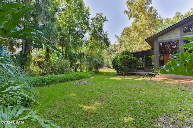 view of yard featuring a sunroom