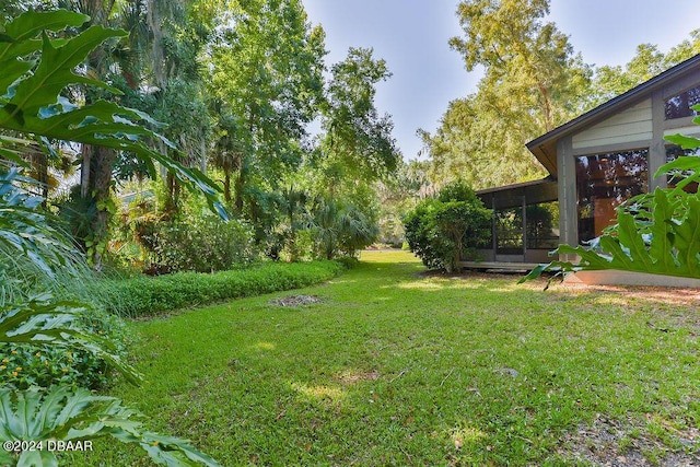 121 Willow Bend Ln, Ormond Beach, FL 32174 - view of grassy yard featuring a sunroom