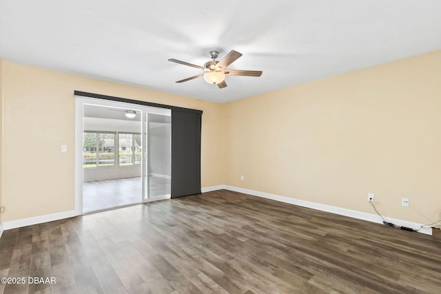 unfurnished room featuring dark wood-type flooring and ceiling fan