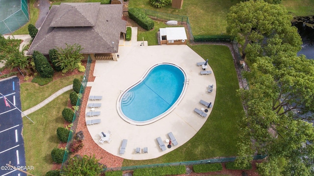 view of pool featuring a patio and a lawn