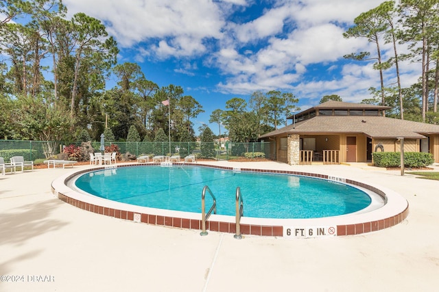 view of pool featuring a patio