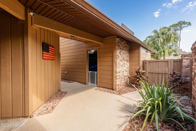 entrance to property featuring a patio