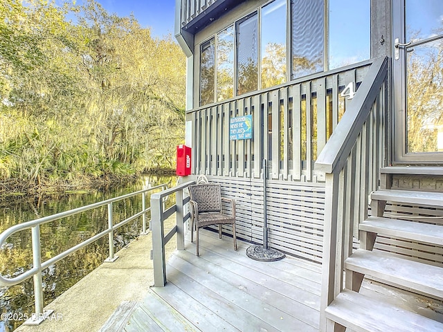 wooden terrace with a water view