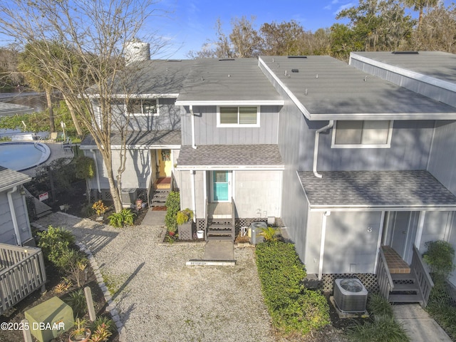 back of house featuring central AC unit