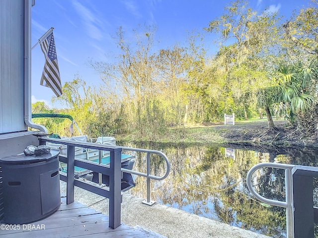 wooden deck with a water view