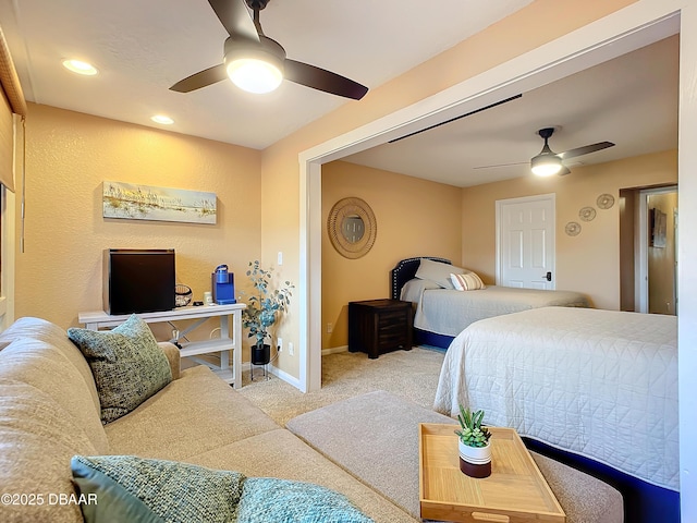 bedroom with ceiling fan and light carpet