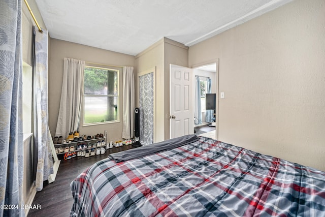 bedroom with wood finished floors