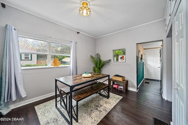 office space with dark wood-style flooring, visible vents, and baseboards