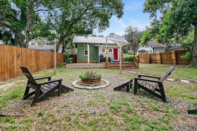 view of yard featuring a fenced backyard and a deck