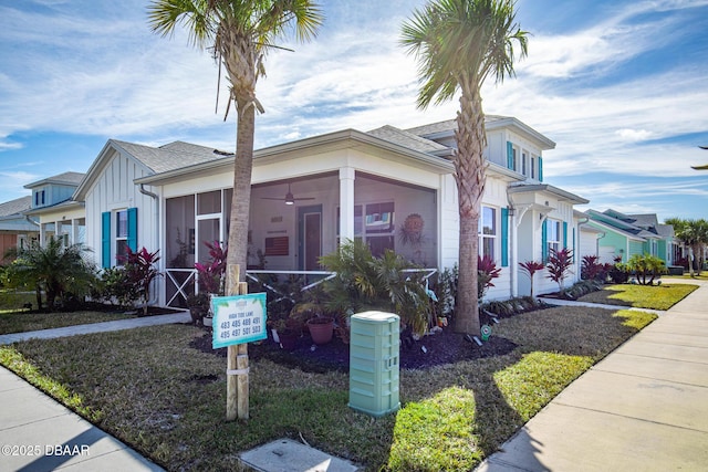 view of front of home with a sunroom