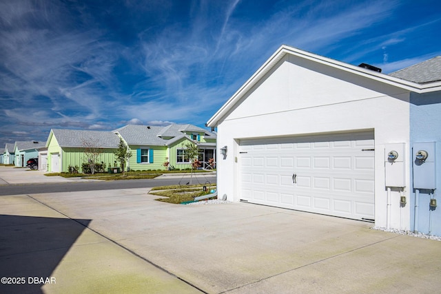 view of side of property featuring a garage