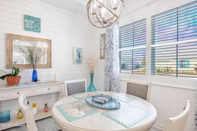 dining space with an inviting chandelier