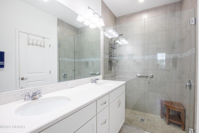 bathroom featuring vanity and a shower with shower door