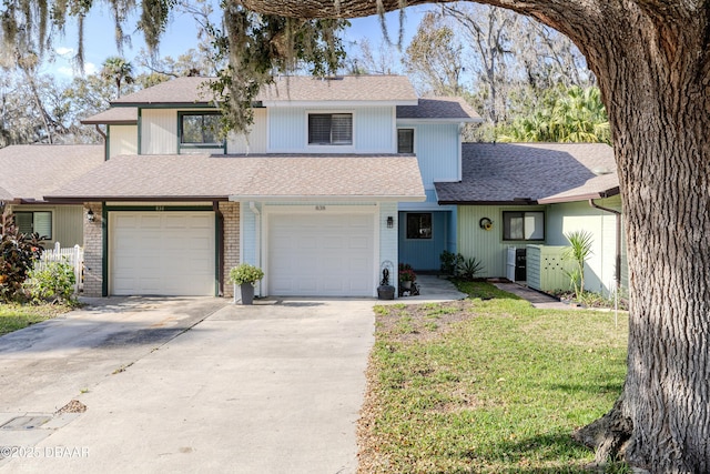 front of property featuring a garage and a front lawn