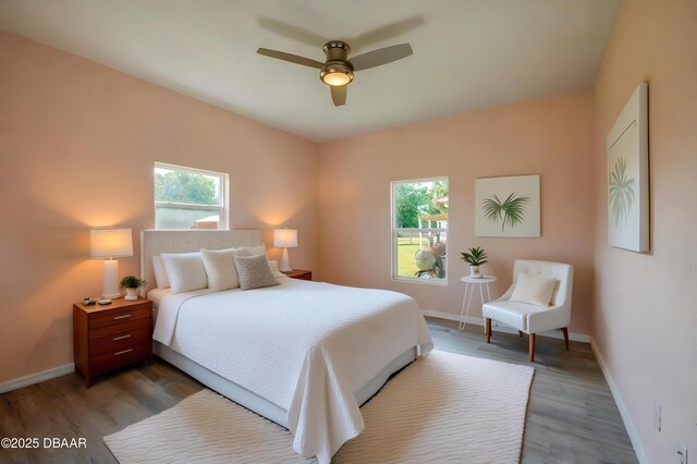 707 Hamilton St, New Smyrna Beach, FL 32168 - bedroom with wood finished floors, baseboards, and a ceiling fan