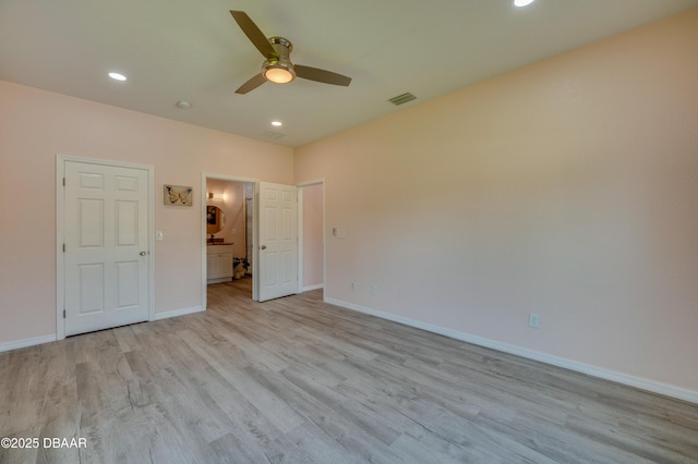 707 Hamilton St, New Smyrna Beach, FL 32168 - unfurnished bedroom featuring light wood finished floors, baseboards, recessed lighting, and ensuite bath