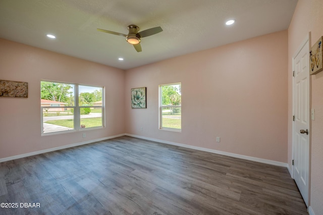 707 Hamilton St, New Smyrna Beach, FL 32168 - unfurnished room with a ceiling fan, wood finished floors, recessed lighting, and baseboards