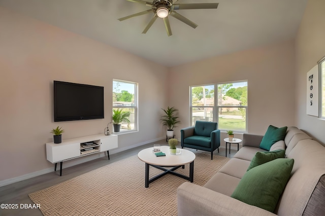 707 Hamilton St, New Smyrna Beach, FL 32168 - living room with wood finished floors, ceiling fan, baseboards, and lofted ceiling