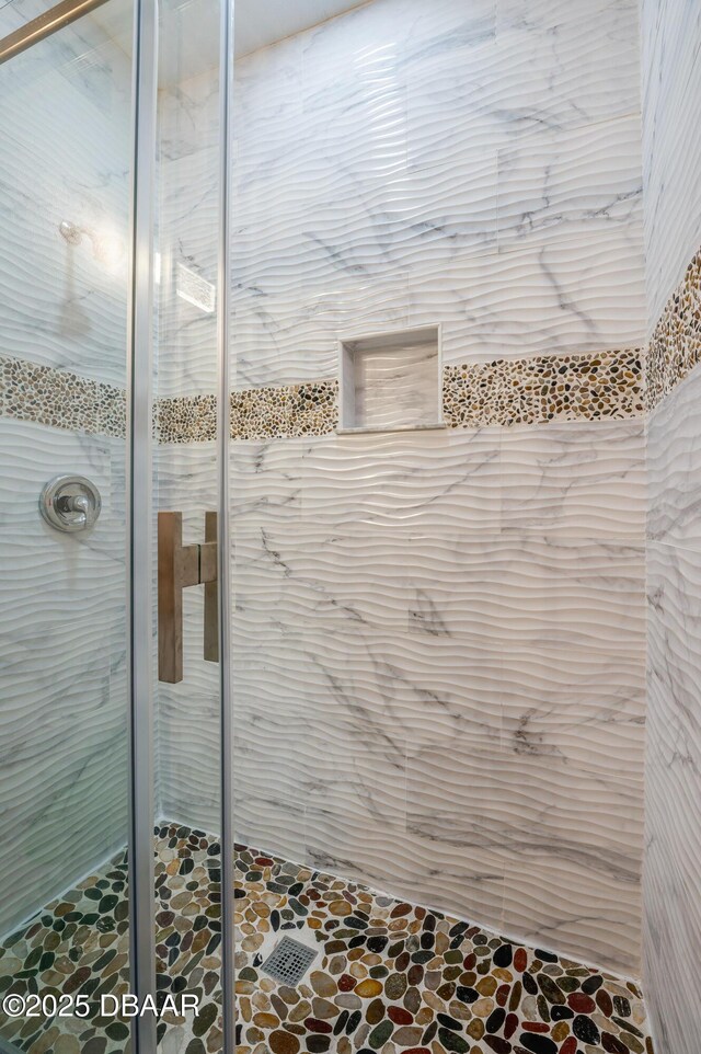707 Hamilton St, New Smyrna Beach, FL 32168 - bathroom featuring a shower stall and stone finish flooring