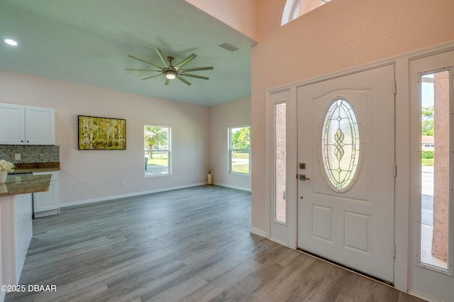707 Hamilton St, New Smyrna Beach, FL 32168 - entrance foyer with a ceiling fan, light wood-style floors, and baseboards