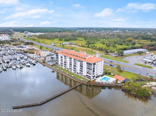 birds eye view of property with a water view