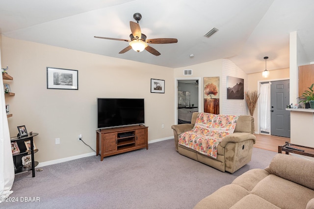 living room featuring light carpet, ceiling fan, and lofted ceiling