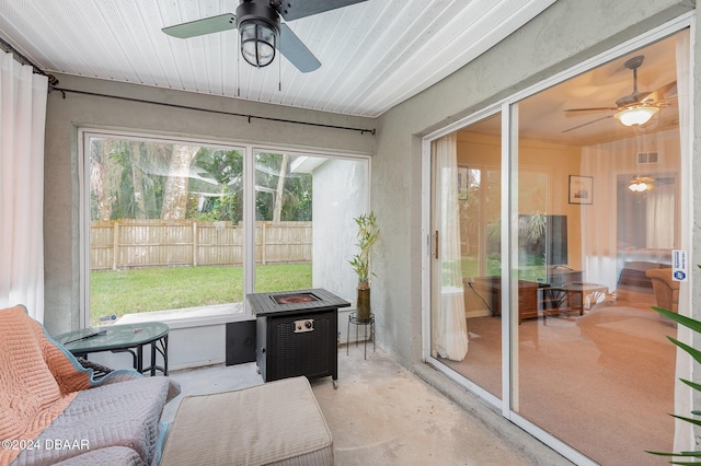 sunroom / solarium with ceiling fan