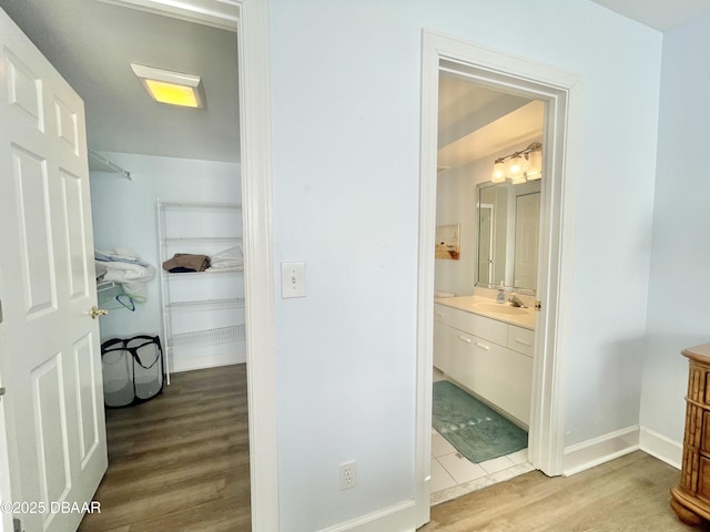 bathroom featuring vanity and hardwood / wood-style flooring