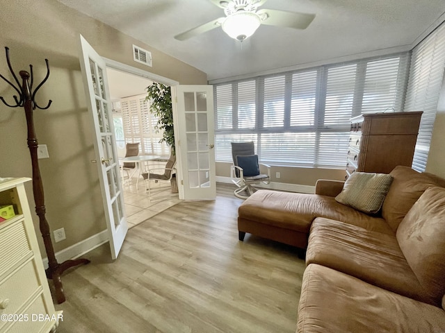 interior space featuring ceiling fan, french doors, and light hardwood / wood-style floors