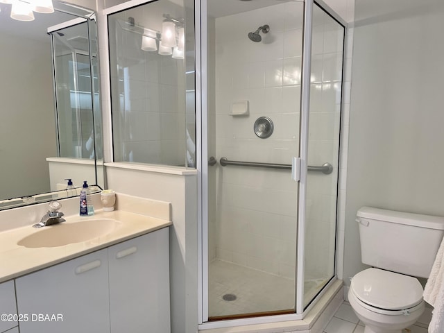 bathroom with vanity, toilet, walk in shower, and tile patterned floors