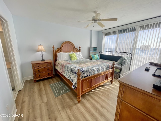 bedroom featuring light wood-type flooring and ceiling fan