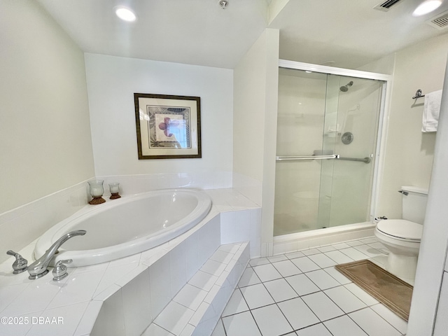 bathroom with toilet, shower with separate bathtub, and tile patterned floors