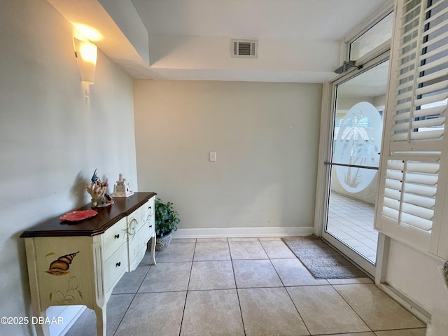 entryway featuring light tile patterned floors