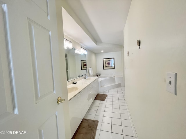 bathroom featuring vanity, a bathing tub, and tile patterned flooring