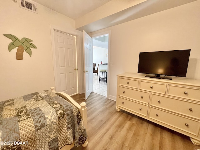 bedroom featuring light wood-type flooring